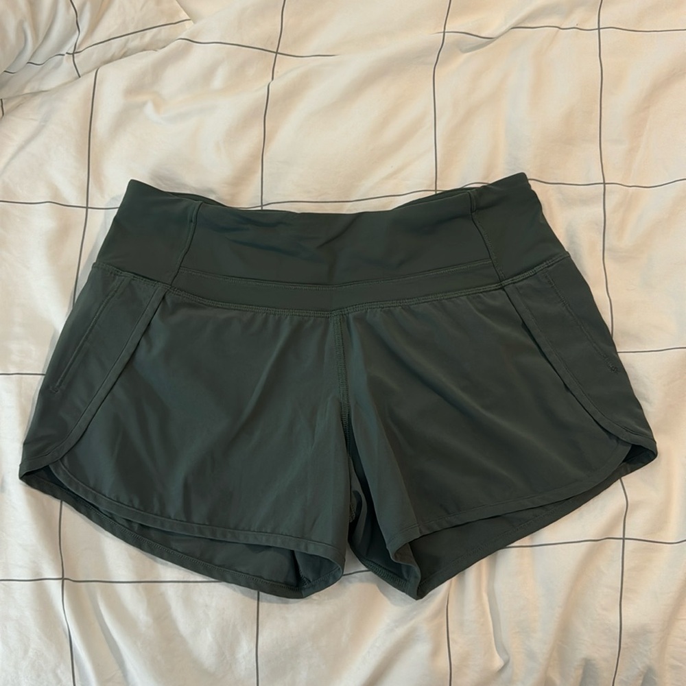 Like new Lululemon dark green hotty hot shorts size 4